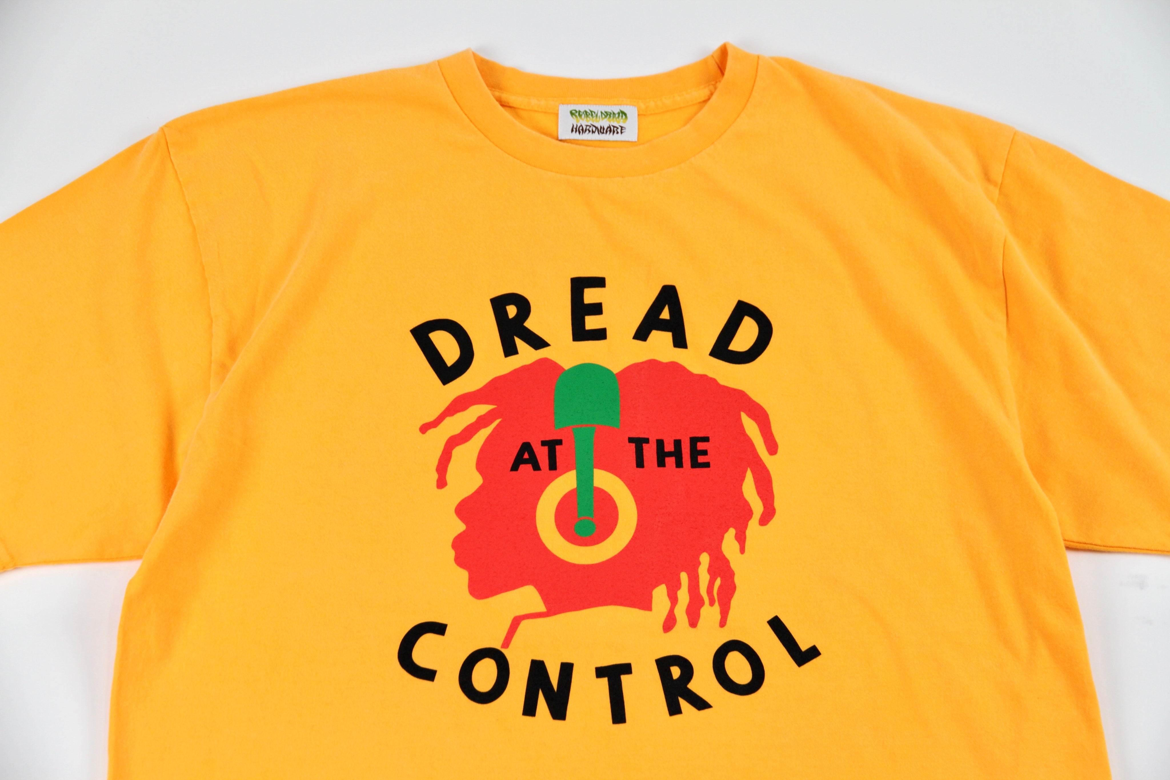 REBEL DREAD HARDWARE/DREAD AT THE CONTROL TEE (GOLD) REBEL DREAD HARDWARE/DREAD AT THE CONTROL TEE (GOLD)